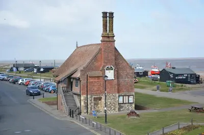 an old brick building on the side of a street at Tamarisk, Aldeburgh in Aldeburgh