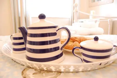 a plate with three stacks of cups and a plate with some bread at High Tide, Crabbe Street, Aldeburgh in Aldeburgh