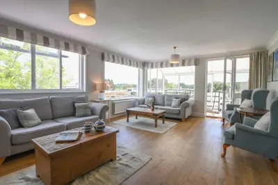 a living room with couches and a table at Beresford House in Woodbridge