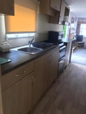 a kitchen with a sink and a stove at Summer plot 8 in Jaywick Sands