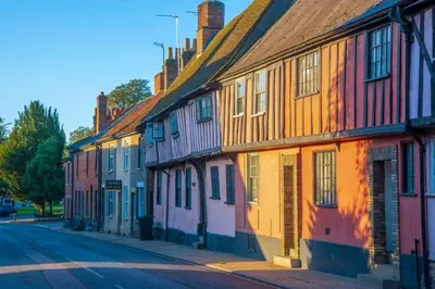 a row of colorful houses on a city street at Crown Street in Bury Saint Edmunds