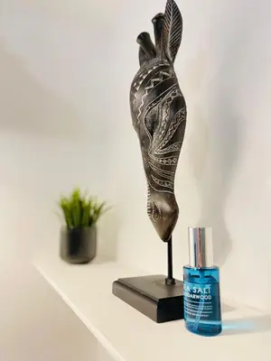 a statue sitting on a shelf next to a container of toothpaste at Cambridge Stay Cozy home with Wi-Fi, Parking Perfect for 2 in Cherry Hinton