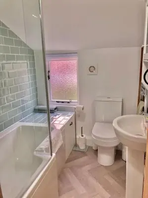 a bathroom with a tub and a toilet and a sink at Almond Cottage Clare - 2 bedroom English Cottage in Clare