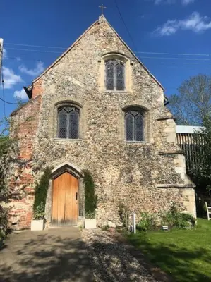an old brick church with a wooden door at Almond Cottage Clare - 2 bedroom English Cottage in Clare