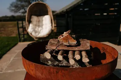 a wooden bowl with a piece of cake in it at Beautiful Cottage in Bredfield near to Woodbridge on the Suffolk Coast in Bredfield