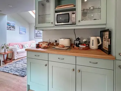 a kitchen with a counter top with a microwave at The Boathouse Uk33900 in Waldringfield