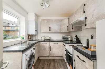 a kitchen with a sink and a dishwasher at Summer Deal 20 PRC OFF 4BR 2BATH Families Groups By Trinity Stays Short Lets & Serviced Accommodation Cambridge in Cambridge