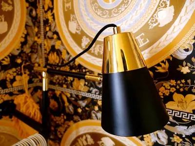 a black and gold lamp hanging on a wall at Deluxe 4 or 5 Bed House with Hot Tub, Cinema Room Sleeps 15 in Saffron Walden