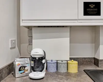 a kitchen counter with a mixer on a counter top at Deluxe Apartment in Southend-On-Sea by Artisan Stays I Free Parking I Sleeps 4 in Southend-on-Sea