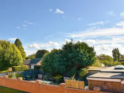 a brick fence in front of a house at Secretseaview in West Mersea