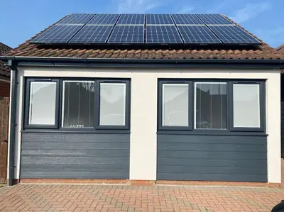a house with solar panels on top of it at Modern Spacious Annex -Ground Floor in Brightlingsea