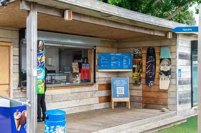 a store with a sign in front of it at Mill Dam Lake House in Saint Osyth