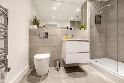 a bathroom with a toilet and a sink and a shower at Tailored Stays - Central Cambridge, Lacon House in Cambridge