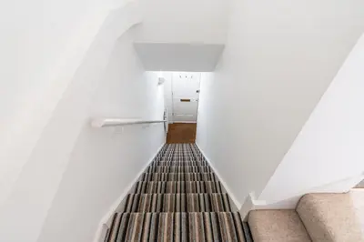 a stairway leading up to the top of a building at The Bolthole in Aldeburgh