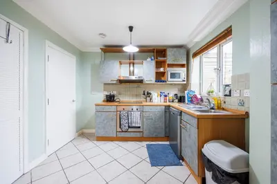 a kitchen with a sink and a counter top at 6 Bedroom Larger group House with Parking Corringham Stanford Le Hope in Horndon on the Hill
