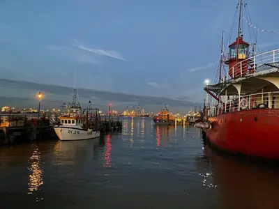 a group of boats are docked in a harbor at Wellie Stern in Harwich