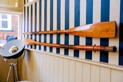 two wooden baseball bats on a wall at Wellie Stern in Harwich