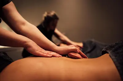 a woman getting her stomachicked by a therapist at Talbooth House & Spa in Dedham