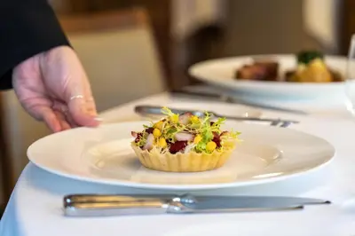 a cupcake on a plate on a table at Talbooth House & Spa in Dedham