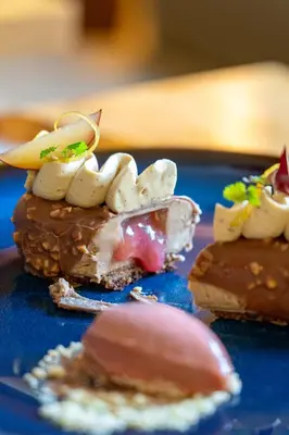 a blue plate with some desserts on it at Talbooth House & Spa in Dedham