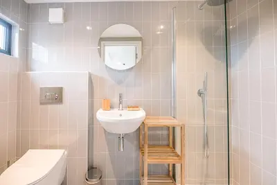 a bathroom with a sink and a shower at Chapel House, Alderton in Woodbridge