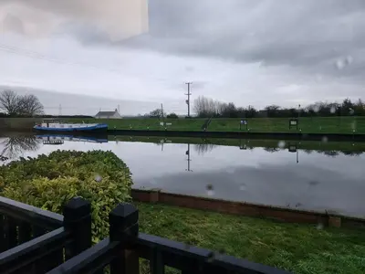 a body of water with a boat in it at The Swan - A Colombo Edition Hotel in Ely