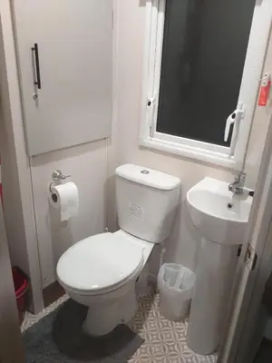 a bathroom with a white toilet and a sink at Caravan in Jaywick,Jaywick sand, Clacton-on-sea in Jaywick Sands
