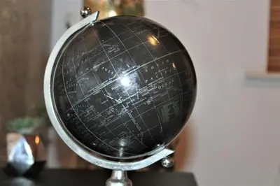 a black and white globe sitting on a table at Lovely Modern Apartment Close to Town Centre in Lexden