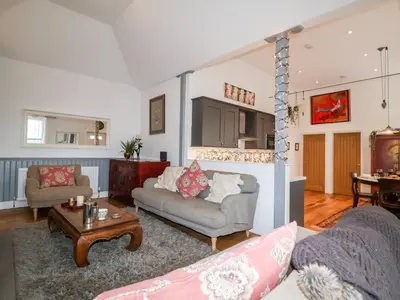 a living room with a couch and a table at Ebenezer Chapel in Saxmundham
