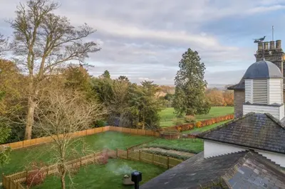 an aerial view of a garden and a building at Bell Tower Cottage in Middleton
