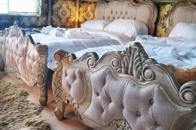 a group of four beds in a room at Deluxe 4 5 Bed Hot Tub Cinema Room 15 in Saffron Walden