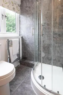 a bathroom with a shower and a toilet at Modern Pet-Friendly Apartment in Cambridge with Garden & Parking in Chesterton