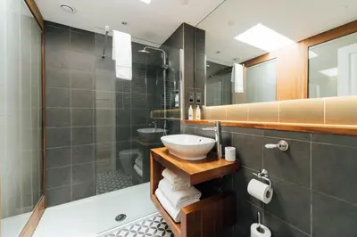 a bathroom with a sink and a shower at The Fox at Willian in Letchworth
