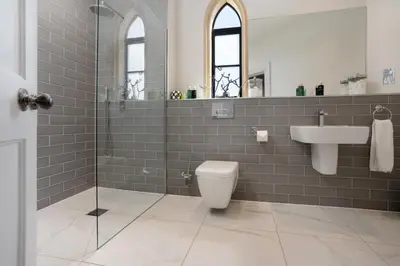 a bathroom with a toilet and a sink and a shower at South Lodge, St Osyth Priory in Saint Osyth