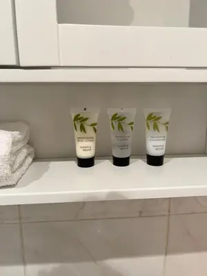 a row of four cups sitting on a shelf at Next-Stop Haven in Harlow
