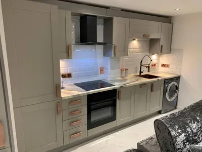 a kitchen with a sink and a stove top oven at Bury St Edmunds - Apartment - Sleeps 2 - Parking in Bury Saint Edmunds