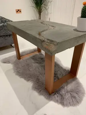 a concrete table with a furry rug under it at Bury St Edmunds - Apartment - Sleeps 2 - Parking in Bury Saint Edmunds
