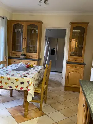 a kitchen with a table with fruit on it at Super King Bed Suite, Executive office, fast WiFi, free parking in St Ives