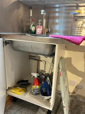 a kitchen counter with a sink and other kitchen items at Studio Annex in Cottenham