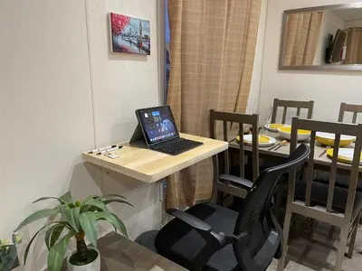 a laptop computer sitting on a desk in a room at VaLa VistA - Holiday Home On The Beach in Jaywick Sands