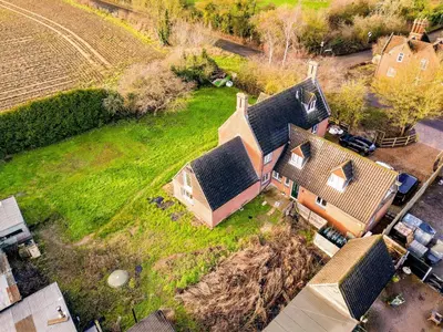 an aerial view of a house with a yard at Unique 5BD Farm House Perfect for Relaxing in Ipswich