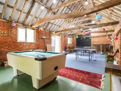 a ping pong room with a pool table at The Granary in Colchester