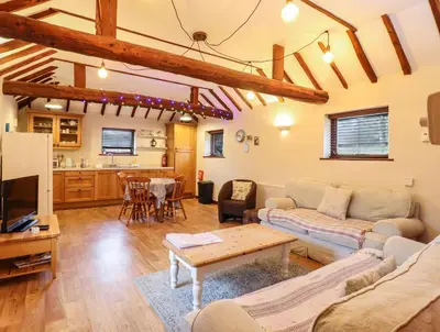 a living room with a couch and a table at The Granary in Colchester