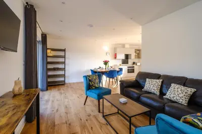 a living room with a couch and a table at Three Tuns - Garden Suite 2 in Wickham Market