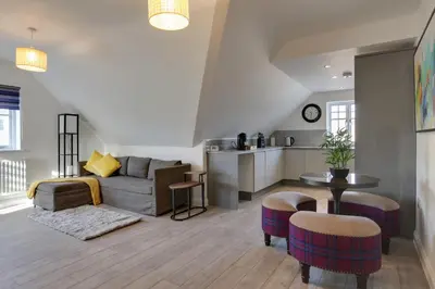 a living room with a couch and a table at Towerview Apartments Braintree in Braintree