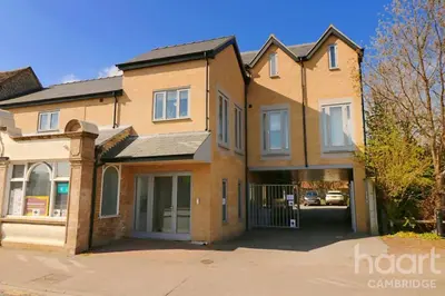 a large brick house with a driveway at Lovely 1 Bedroom Flat with Free Off Road Parking in Chesterton