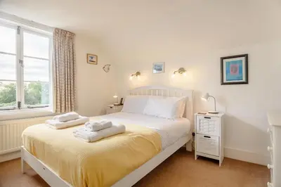 a bedroom with a bed with two towels on it at 4 Bed in Aldeburgh oc-al123 in Aldeburgh