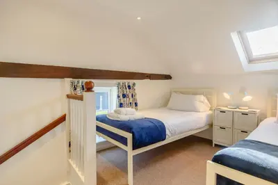 a bedroom with two beds and a window at 4 Bed in Aldeburgh oc-al123 in Aldeburgh