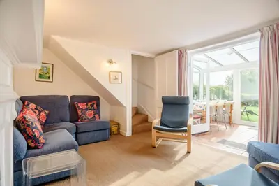 a living room with a couch and a chair at 4 Bed in Aldeburgh oc-al123 in Aldeburgh