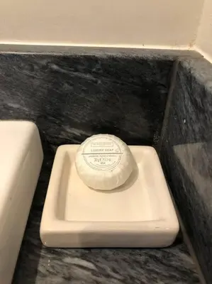 a toilet seat with a lid sitting on top of it at The Stables in Colchester